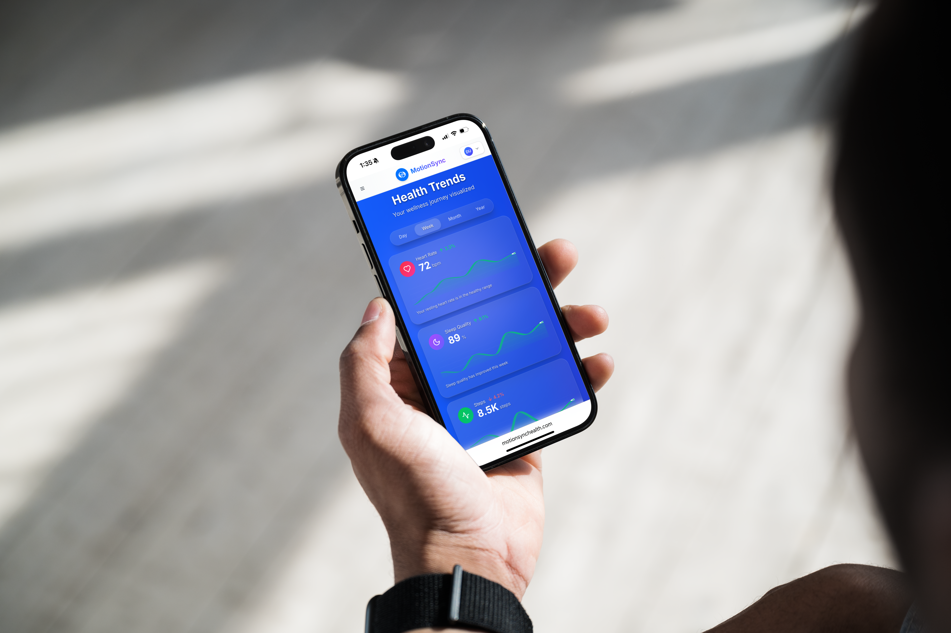 Person checking health trends on MotionSync app showing dashboard